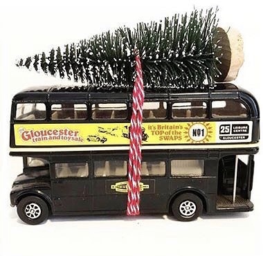 Wonderful vintage Routemaster bus with bottle brush tree