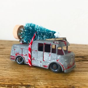 Wonderful little vintage fire engine with bottle brush tree