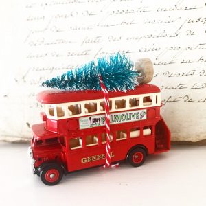Beautiful little vintage advertising bus with bottle brush tree