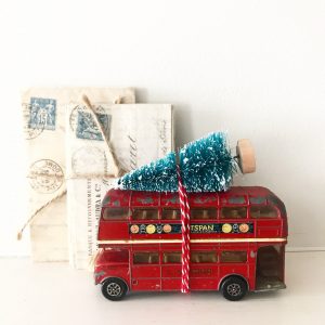 Wonderful vintage toy bus with bottle brush tree