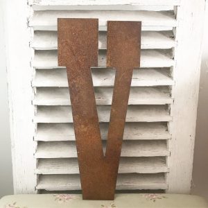 Wonderful old rusted metal shop sign letter v